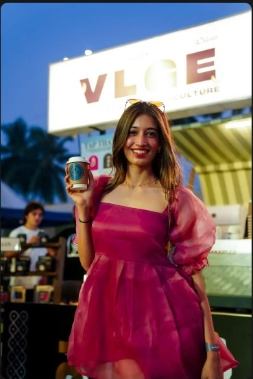 A smiling guest caught in the arrival glow