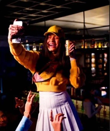 Guest taking a lively selfie in a bar
